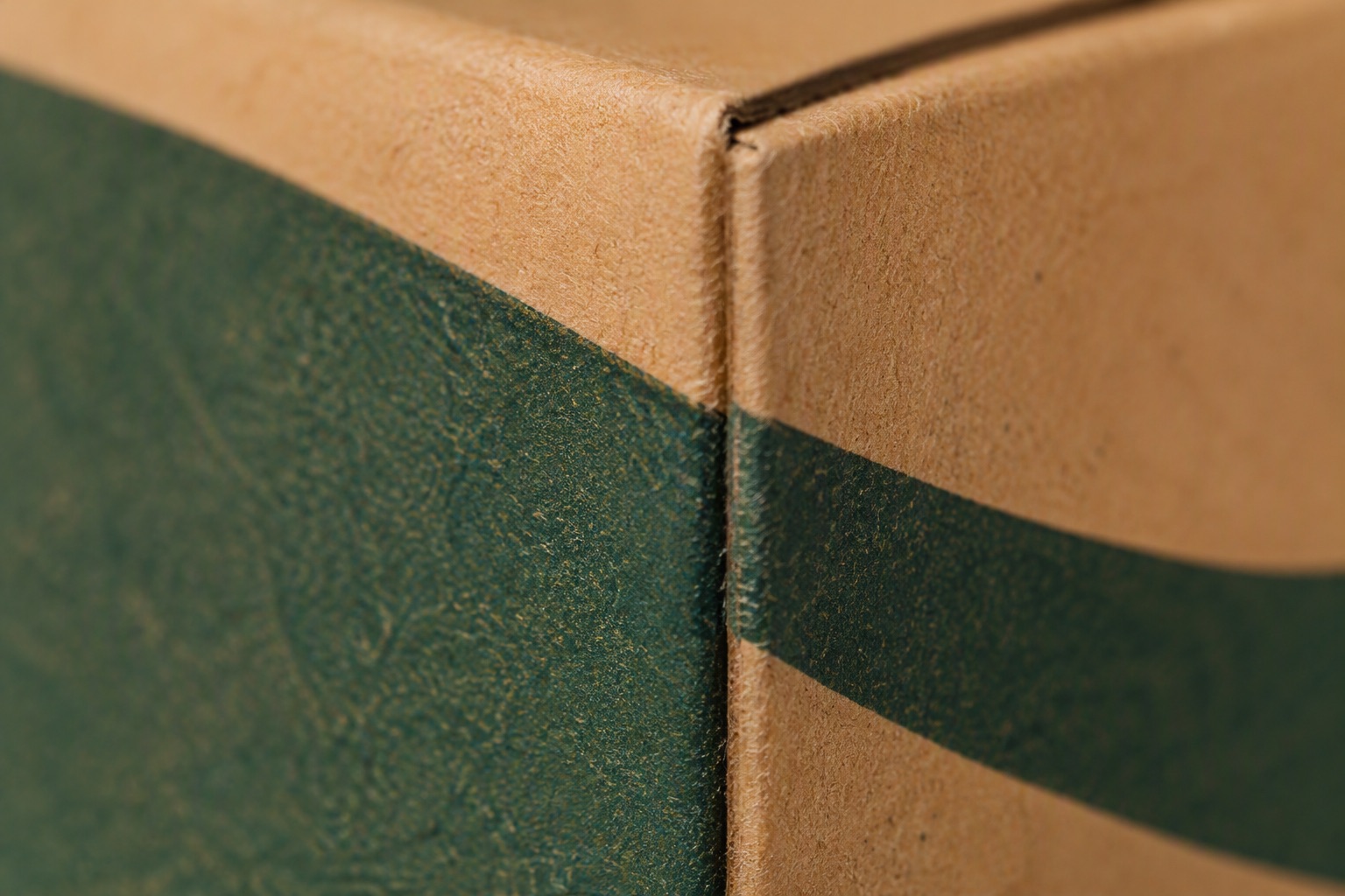 Macro photograph of a printed carton surface showing ink texture and paper fibre