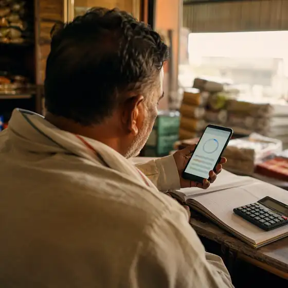 A partner checking scheme progress on a phone