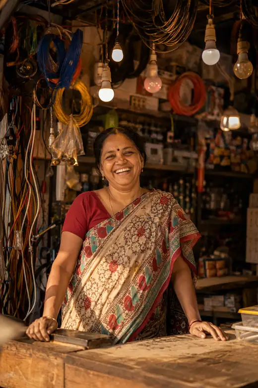 A retailer behind her shop counter